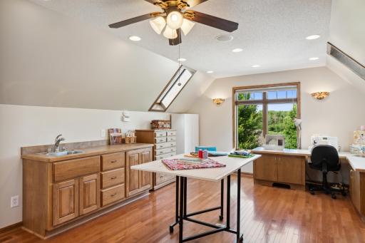 It also features built-in speakers, a ceiling fan, sconce lighting, and a sink. and three of those skylight windows even open!