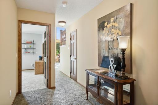 The hallway behind the Great Room leads to two large bedrooms, a full bath, a storage closet and the utility room.