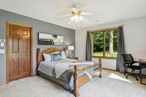 The door leads to a large walk-in closet, which attaches directly to a full bathroom.
