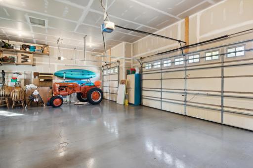 The 1,100+ Square Foot garage is heated, insulated, and has floor drains, hot AND cold water and extra high ceilings.