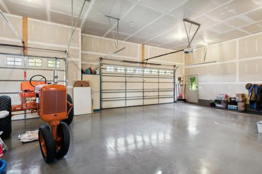 There are two service doors that access the outside, as well as the extra large overhead doors, which both have openers - one of which has MyQ WiFi connectivity.