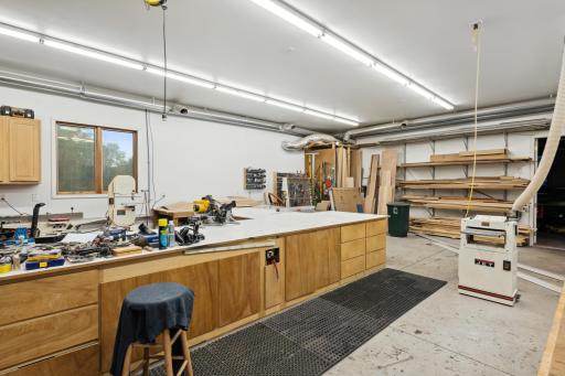 Wired for 220 and 110. Separate 200 amp service. All outlets 20A. Floor drain. 10'8" tall ceilings. Marvin windows. Six ceiling outlets. Everything attached included except compressor and air hose reel. All else goes with the sellers.