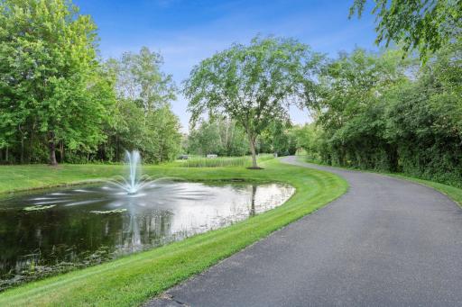 The 12' wide asphalt driveway traverses past this beautiful pond, approximately 280 yards from the street to the home.
