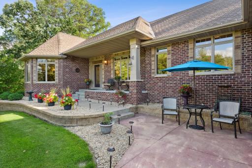 Enjoy sitting outside on the custom colored concrete patio. The landscaping is gorgeous, yet simple & classic. The concrete front porch is 21.5x5.5 and fully covered.