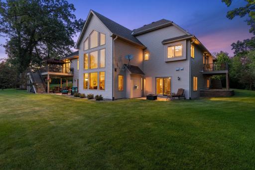 This home has so many outdoor living spaces - multiple patios, multiple decks and porches, multiple fire pits, so much green space and much, much more!