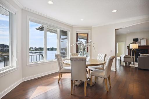 Eat-in area walks out to generous screen porch.jpg