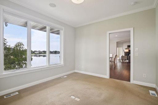 Main floor den w/closet off kitchen and laundry room.jpg