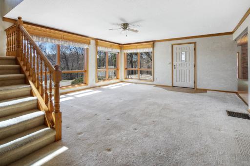 Living room with stairs up to the loft/ 3rd bedroom