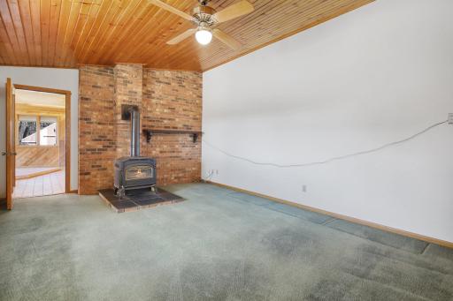 Main floor family room with gas fireplace and the vaulted ceilings