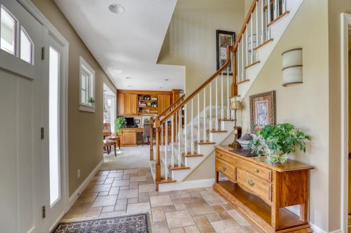 Inviting foyer leads to kitchen on the left and office/family room straight ahead.
