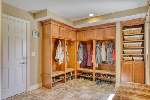 The mud room has plenty of space for your coats, boots, hats, and gloves.