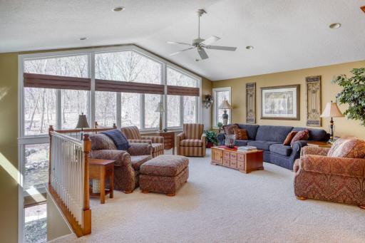 The living room that overlooks the woodland beyond is a super for entertaining guests.