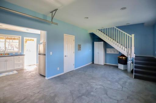 The garage area of the pool house could become a living room and the upstairs could become a bedroom. All you would need to do would be to run a gas/water line and add a furnace and it could become a fantastic guest house or office.