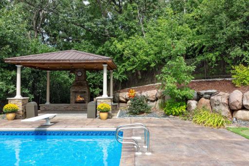 The stone fireplace offers style and warmth on chilly evenings.