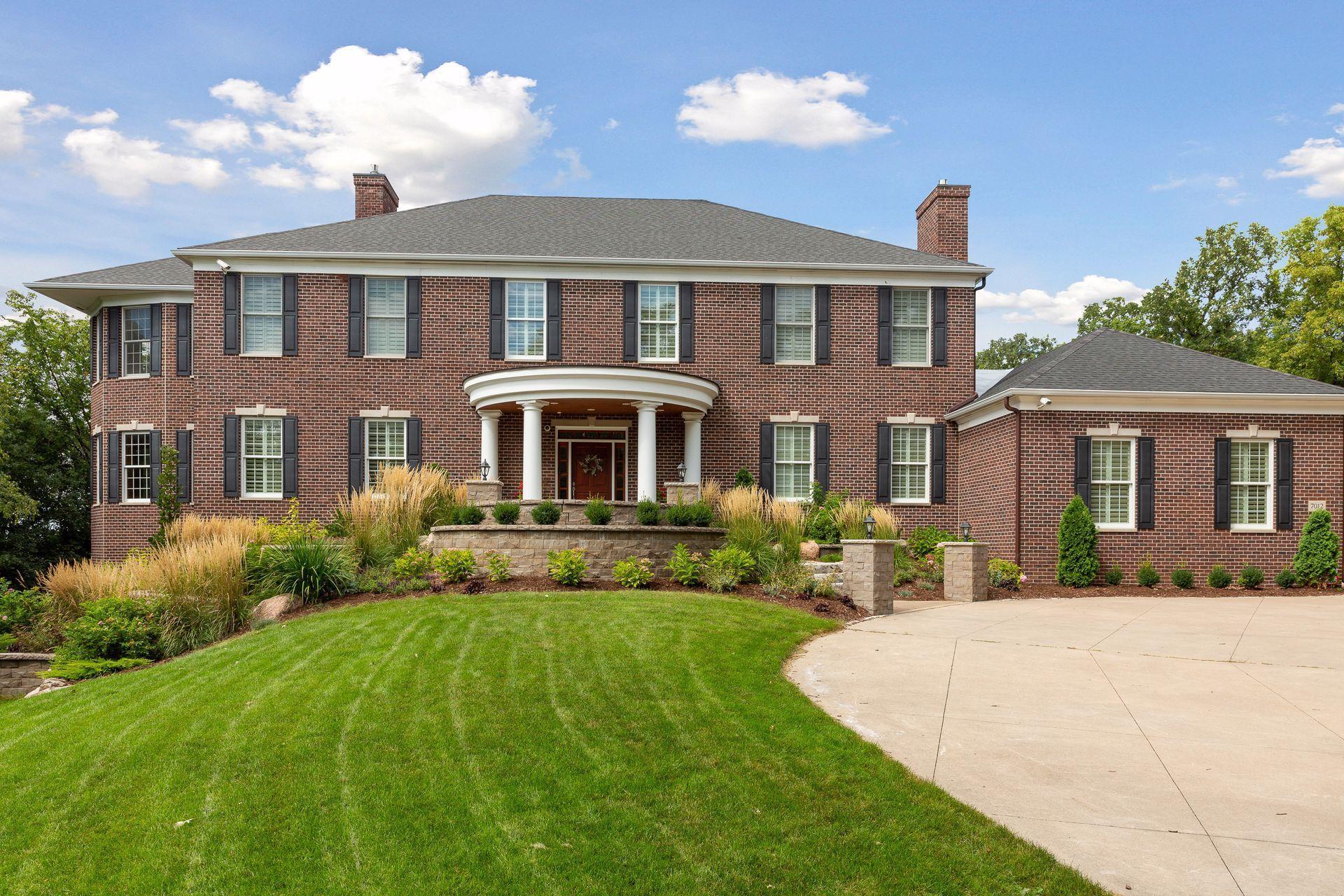 Introducing 7012 Kerry Road in Edina, Minnesota. Nestled on a private cul-de-sac in the coveted Tupa Woods neighborhood, this 2003 built Georgian sits on 1.32 acres with stunning treetop views.