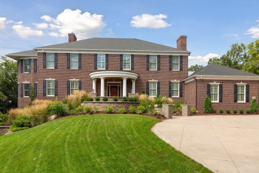 Introducing 7012 Kerry Road in Edina, Minnesota. Nestled on a private cul-de-sac in the coveted Tupa Woods neighborhood, this 2003 built Georgian sits on 1.32 acres with stunning treetop views.