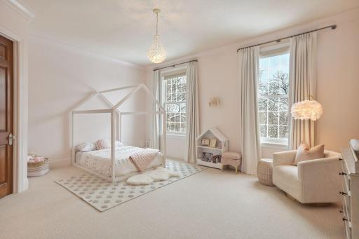 Three additional en suite bedrooms complete the upper level.