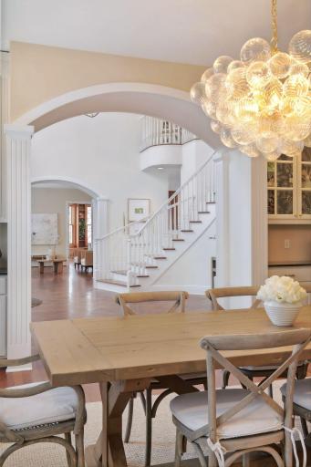 The formal dining room is illuminated by this stunning chandelier.