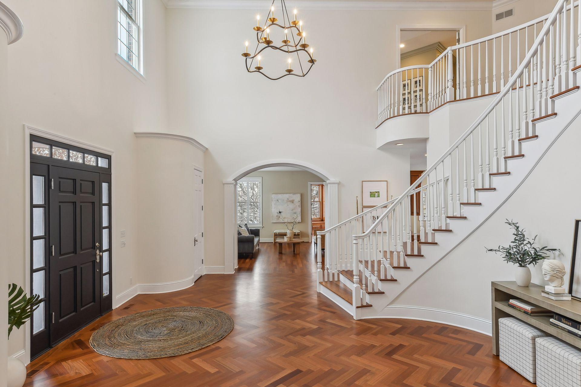 Brazilian Cherry herringbone floors guide you past the formal living and dining rooms.