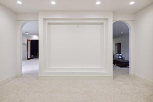 The lower level theatre room is the perfect space to gather for movie night.