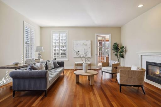 The double-sided fireplace in the living room also provides warmth and ambiance to the family room.