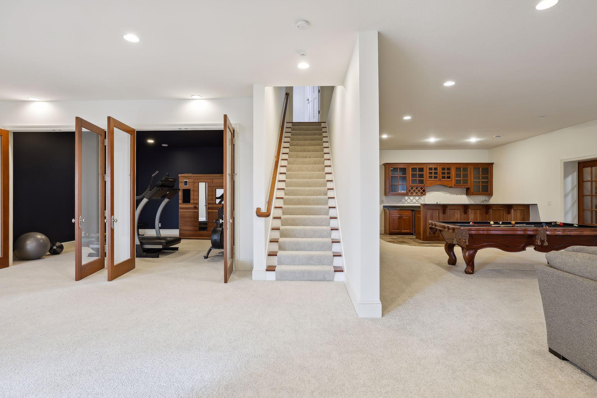 The lower level showcases the family room, theater room, wine cellar, exercise room and fifth bedroom.