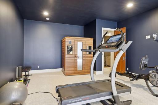 You will love the ten foot ceilings in the lower level home gym.