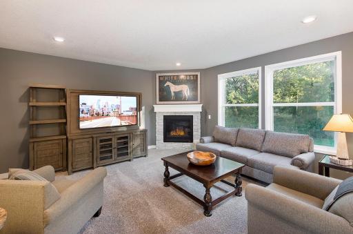 The fireplace in the great room will have tile with full wood surround.
Photo from a similar home.