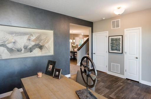 The front flex room as you enter. In this home features glass French doors.
Photo from a similar home.