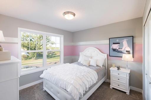 Secondary bedroom on the upper level.
Photo from a similar home.