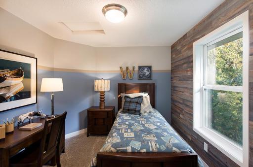 Secondary bedroom on the upper level.
Photo from a similar home.