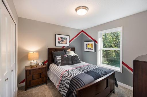 Secondary bedroom on the upper level.
Photo from a similar home.
