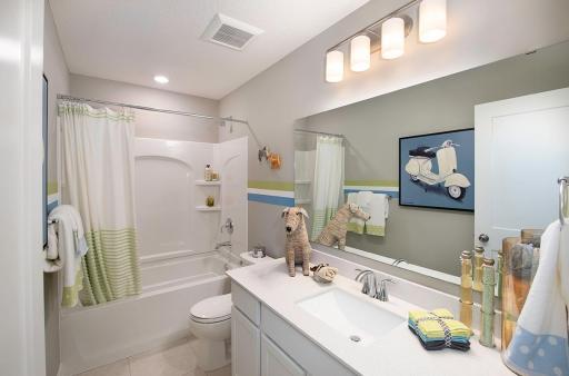 Guest bath with tub/shower combination and large rectangular sink.
Photo from a similar home.