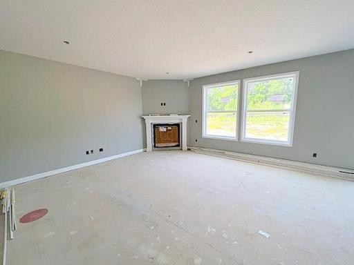 Tile gas fireplace features a full wood surround and wired for TV above.
Photo taken June 16th.