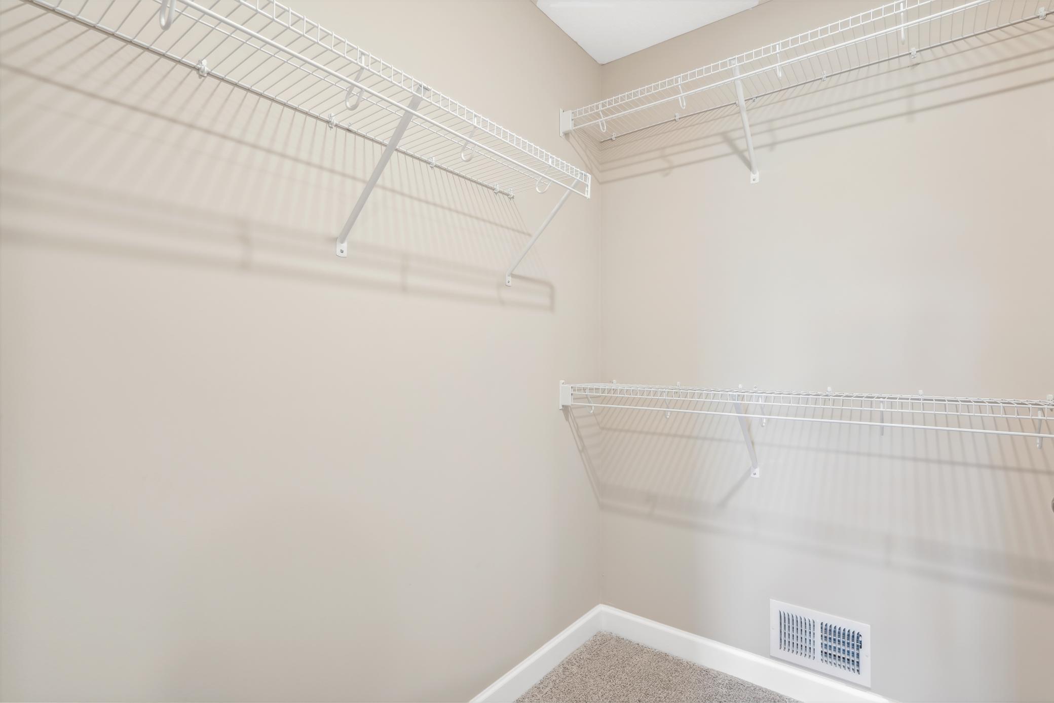 Plenty of storage is available in this owner's walk in closet! *Please note, photos are of a model and are not the actual home, but very similar.