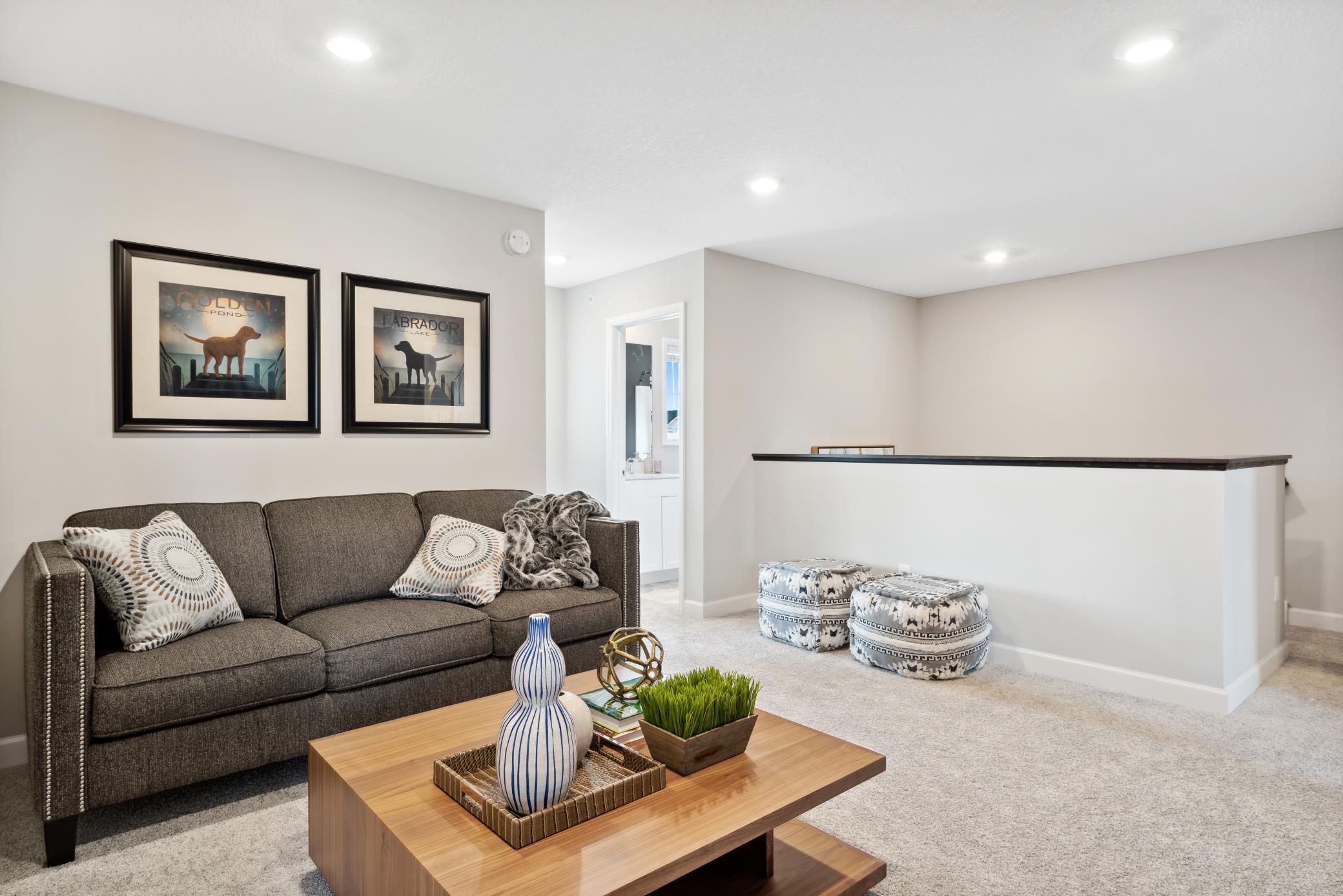 Another view of the upper level loft. *Note, photos are of a model, not of actual home.