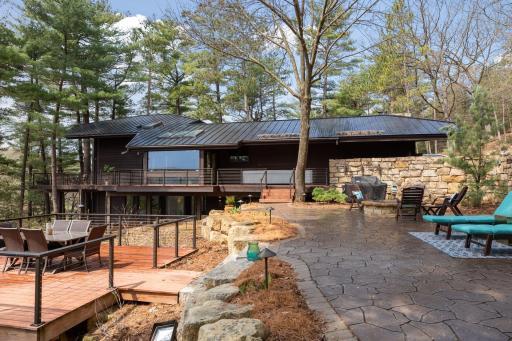 Redwood siding exterior and a new standing seam metal roof.