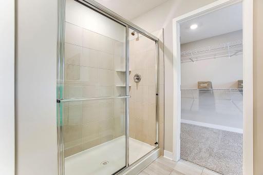 The primary bath offers a tiled walk-in shower.