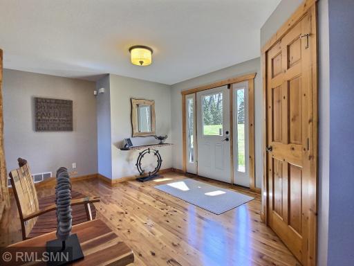 The foyer has a large coat closet and more unique decor.