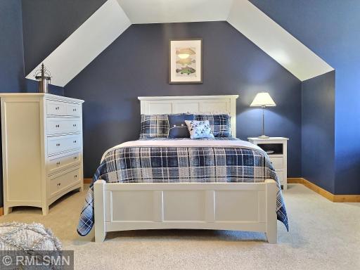 This bedroom is so cheerful and calming. The contrast between the white furniture and the navy paint and details is stunning!