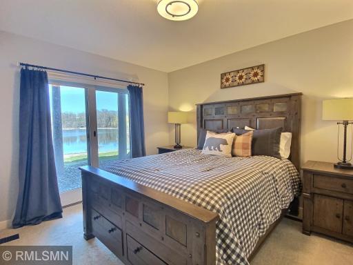 This adorable 4th bedroom is located in the lower level. Meaning it has a heated floor! A special bonus is the patio door that lets the sunshine drench the room! Large walk-in closet and extra linens!