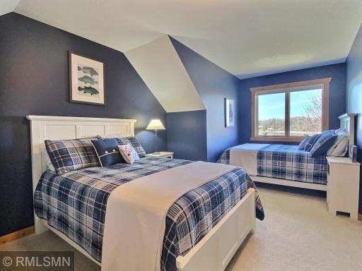 This room has a great lake view and sleeps 4. The walk-in closet has a window and is large enough for a pack and play if you need extra room for a little one.