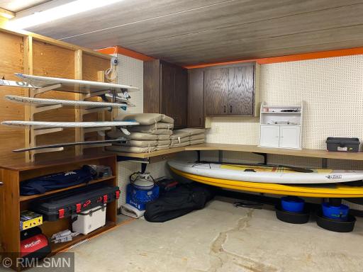 There is additional storage in the tuck under garage. These wake boards and stand-up paddle boards are NOT included in the ale. Seller will be keeping all lake equipment.