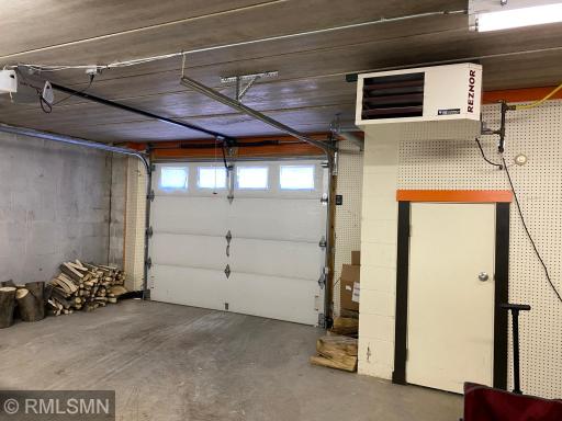 The tuck under garage is also heated by a Rexnor gas heater. There is also a drain in both garages.