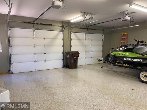This is an amazing garage has epoxy floors and measures 30 x 24 with 2 8 x 10 doors. It is insulated and sheet rocked and is heated with a Reznar, gas heater. Fluorescent lighting, washtub, extra refrigerator and access to the tuck under garage too