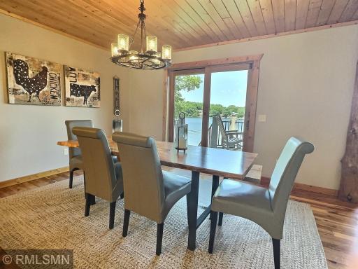 The casual dining area has a fantastic view of the lake! The unique lighting has a steampunk vibe and is on a dimmer switch to set the mood.