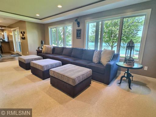 And cuddle up together with this oversized couch and 3 comfortable ottomans. This room has heated floor and accent lighting in the ceiling.