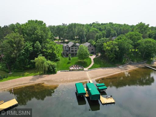 Gorgeous home and landscaping. Many perennials are planted around the property for annual beauty with minimal work. The tuck under garage on the lake side is perfect for storing lake equipment and watercraft.