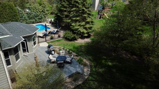 This yard has gorgeous landscape and natural barrier privacy.