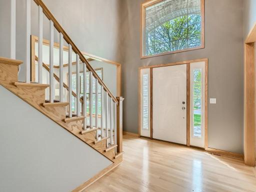 Soaring ceilings welcome you into the foyer with a grand staircase.